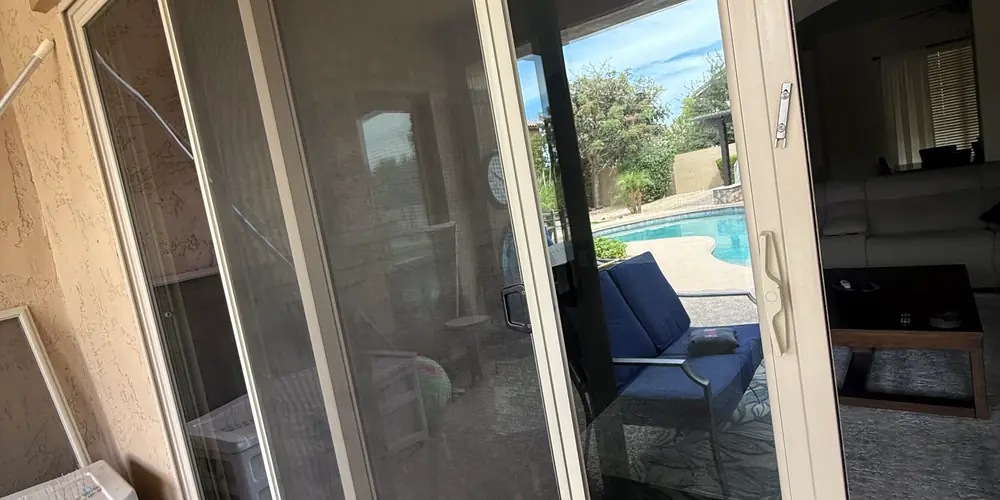 Sliding patio door panel and handle area